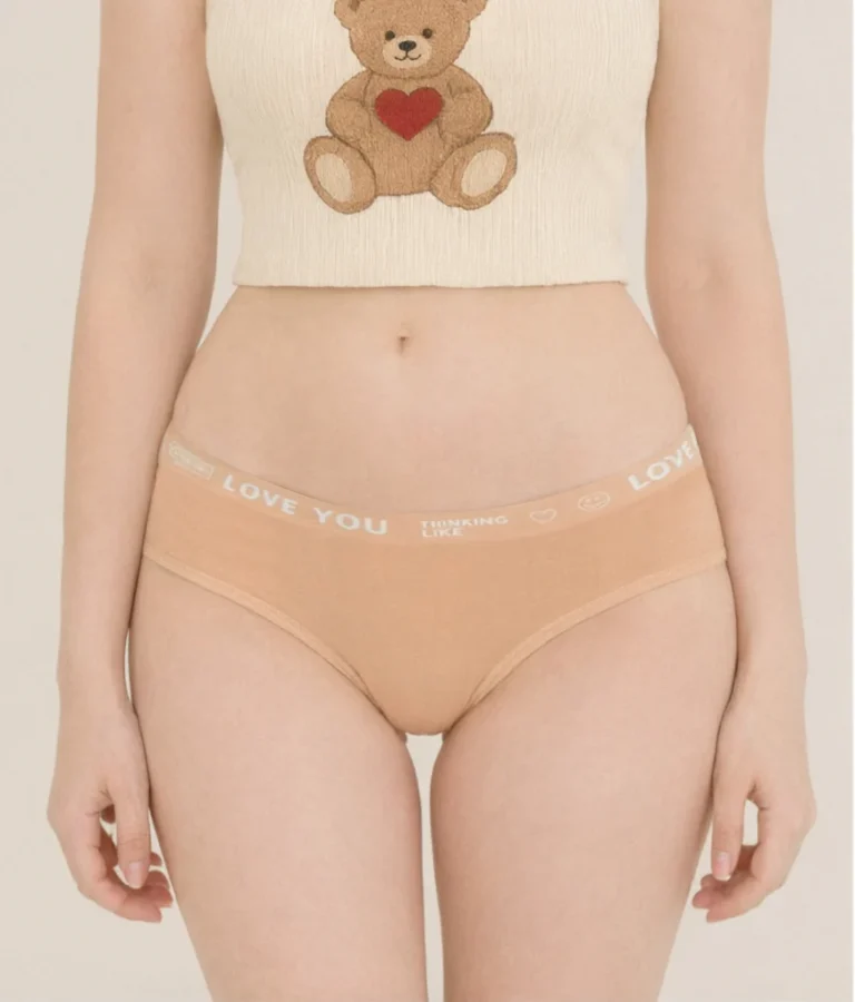 Close view of the peach LOVE YOU slogan-band cotton thong DF5124 with a tonal printed waistband