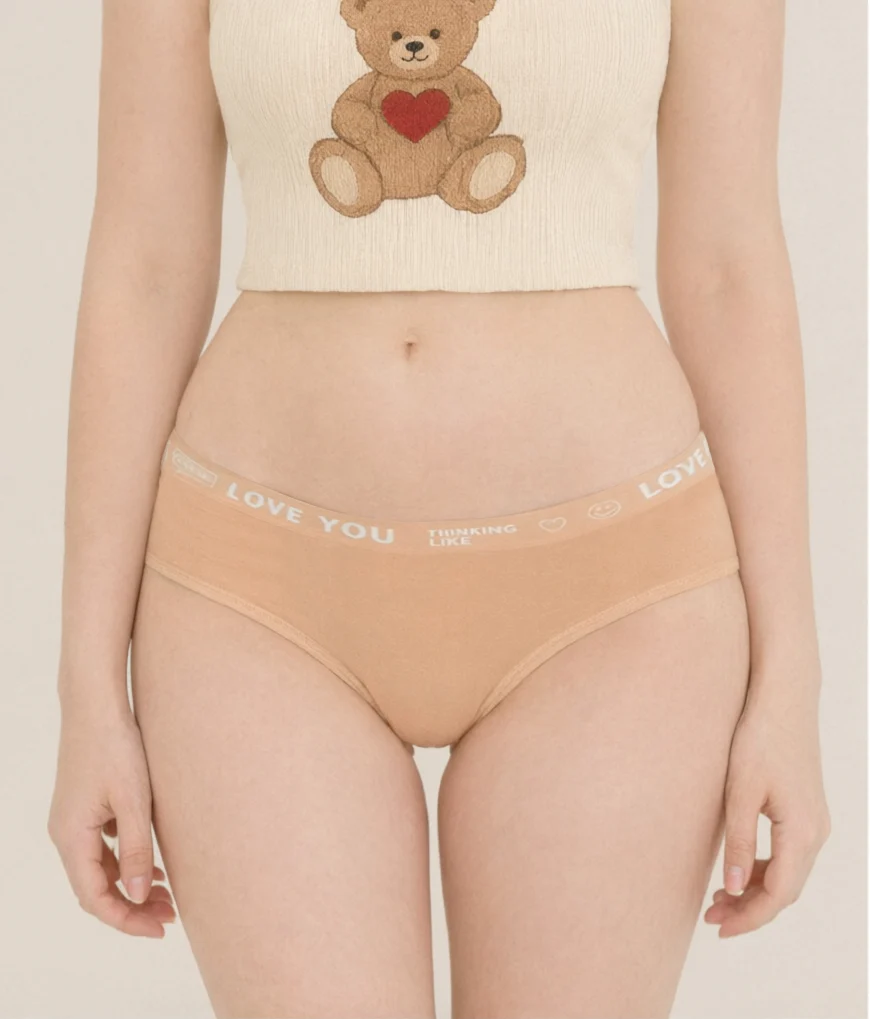 Close view of the peach LOVE YOU slogan-band cotton thong DF5124 with a tonal printed waistband