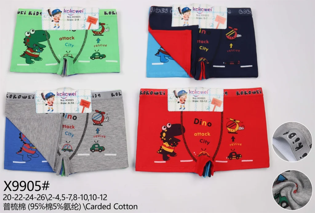 Boys' cotton boxer brief X9905 with a dinosaur, helicopter and Dino Attack City print, shown in five colours