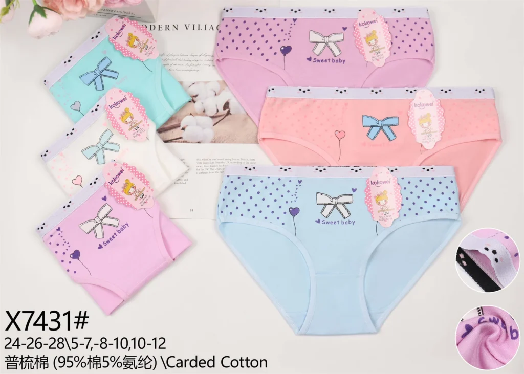 Girls' cotton brief X7431 with a bow and dot print, shown in six pastel colours
