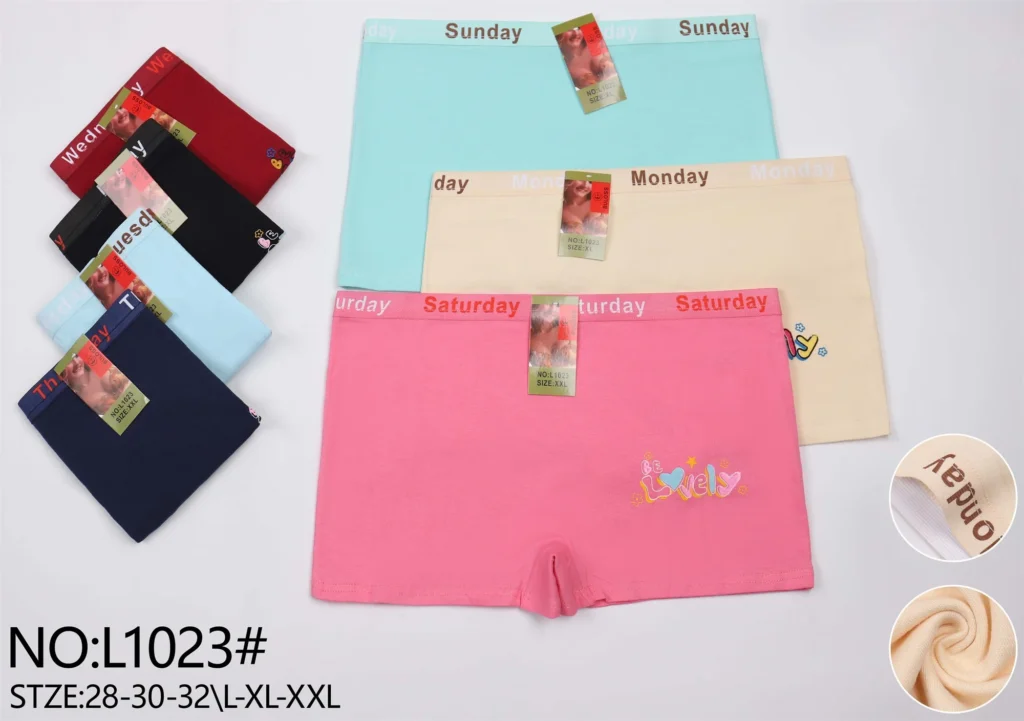 Girls' cotton boyshort L1023 with a day-of-the-week waistband and a Be Lovely motif, shown in seven colours
