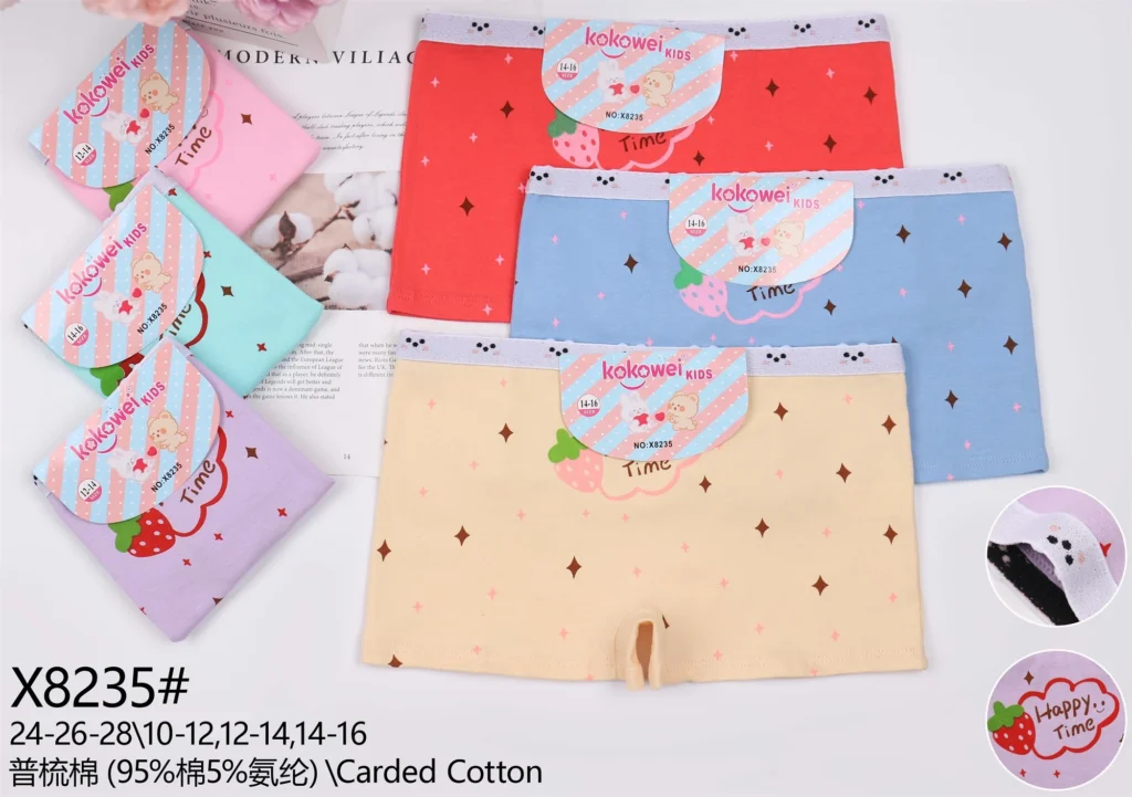 Girls' cotton boyshort X8235 with a strawberry Happy Time motif and a sparkle print, shown in six pastel colours