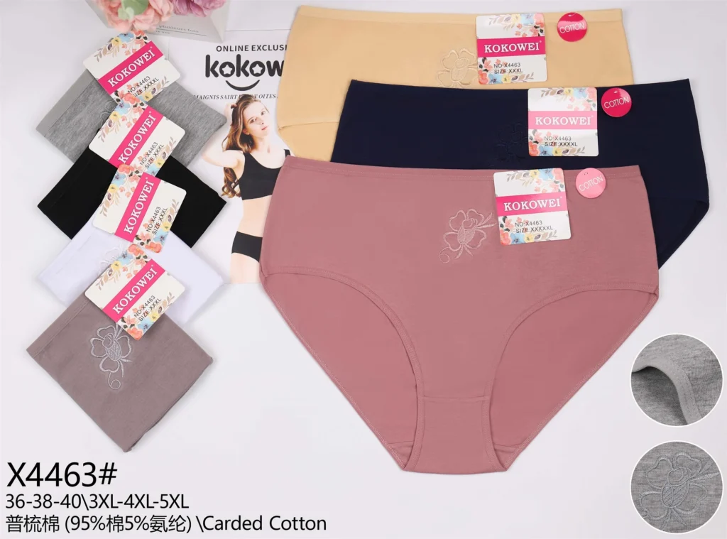 Plus-size cotton brief X4463 with an embroidered flower on the hip, shown in seven colours