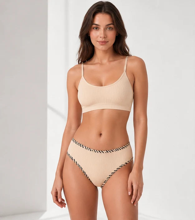 Ribbed cotton Brazilian brief in cream, front view on model