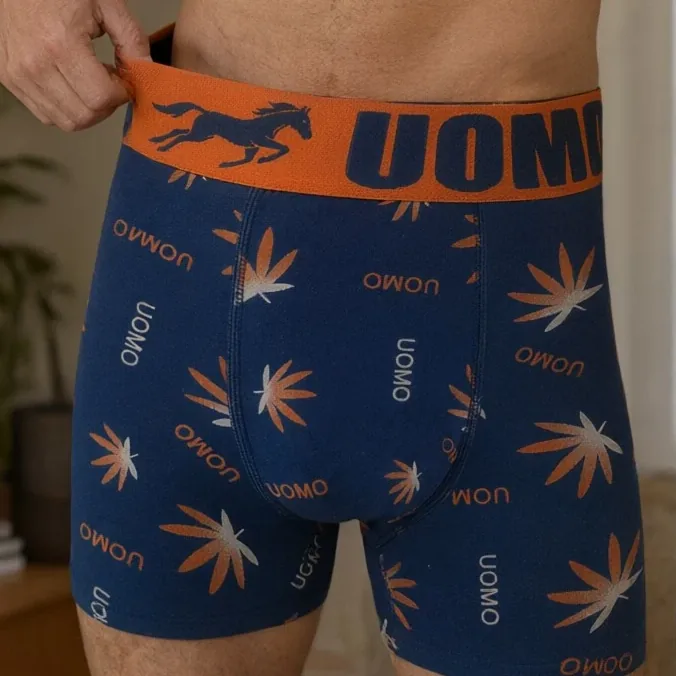 SDUO-7964BMH leaf-print boxer brief in navy, the orange running-horse waistband held out to show the elastic